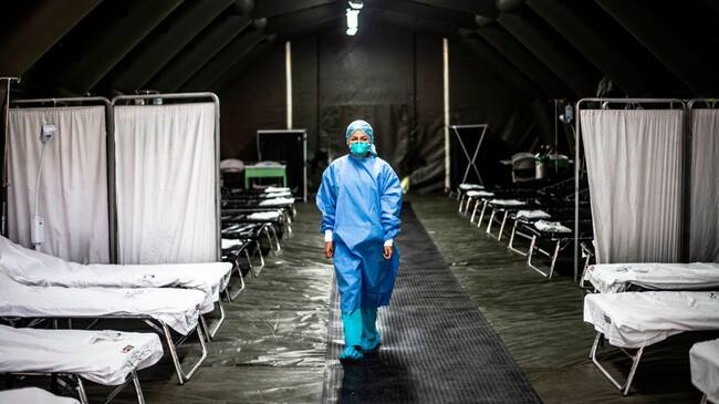 TOPSHOT - A specialist walks inside a mobile unit set up by the Peruvian Ministry of Health as a preventive measure if a case of the COVID-19 virus comes up, at the Hipolito Unanue Hospital, in Lima on February 27, 2020. - So far, Peru has no record of the COVID-19 virus cases. (Photo by Ernesto BENAVIDES / AFP) (Photo by ERNESTO BENAVIDES/AFP via Getty Images)