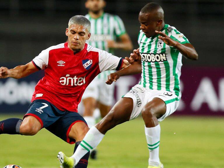 PEREIRA, COLOMBIA - MAY 12: Brian Ocampo of Nacional competes for the ball with Yerson Candelo of Atletico Nacional during a match between Atletico Nacional and Nacional as part of group F of Copa CONMEBOL Libertadores 2021 at Estadio Hernán Ramírez Villegas on May 12, 2021 in Pereira, Colombia. (Photo by Carlos Ortega - Pool/Getty Images)