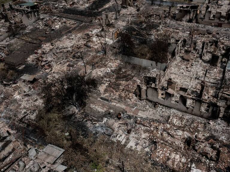 An aerial view shows destroyed houses after strike in the town of Pryvillya at the eastern Ukrainian region of Donbas on June 14, 2022, amid Russian invasion of Ukraine. - The cities of Severodonetsk and Lysychansk, which are separated by a river, have been targeted for weeks as the last areas still under Ukrainian control in the eastern Lugansk region. (Photo by ARIS MESSINIS / AFP) (Photo by ARIS MESSINIS/AFP via Getty Images)