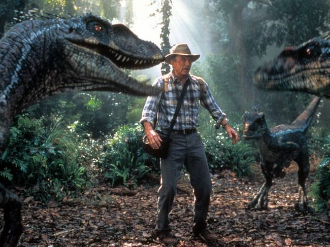 Sam Neill is confronted by three dinosaurs in a scene from the film 'Jurassic Park III', 2001. (Photo by Universal/Getty Images)