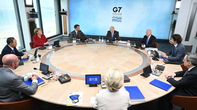 CARBIS BAY, CORNWALL - JUNE 11: (Clockwise from Top C) British Prime Minister Boris Johnson, US President Joe Biden, Canadian Prime Minister Justin Trudeau, Italian Prime Minister Mario Draghi, President of the European Commission Ursula von der Leyen, President of the European Council Charles Michel, Japanese Prime Minister Yoshihide Suga, German Chancellor Angela Merkel and French President Emmanuel Macron, sit around the table at the top of the G7 meeting in Carbis Bay, on June 11, 2021 in Carbis Bay, Cornwall. UK Prime Minister, Boris Johnson, hosts leaders from the USA, Japan, Germany, France, Italy and Canada at the G7 Summit. This year the UK has invited India, South Africa, and South Korea to attend the Leaders' Summit as guest countries as well as the EU. (Photo by Leon Neal - WPA Pool/Getty Images)