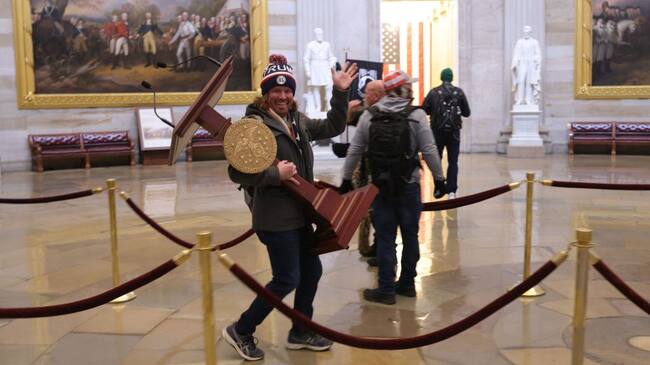 WASHINGTON, DC - JANUARY 06: Protesters enter the U.S. Capitol Building on January 06, 2021 in Washington, DC. Congress held a joint session today to ratify President-elect Joe Biden's 306-232 Electoral College win over President Donald Trump. A group of Republican senators said they would reject the Electoral College votes of several states unless Congress appointed a commission to audit the election results. (Photo by Win McNamee/Getty Images)