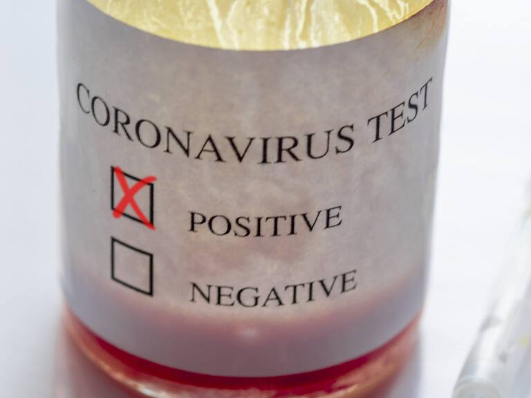 Syringe and ampoule containing coronavirus positive blood test