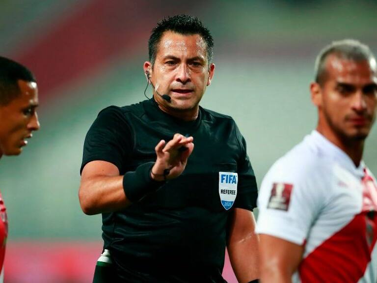 Chilean referee Julio Bascunan conducts the 2022 FIFA World Cup South American qualifier football match between Peru and Brazil at the National Stadium in Lima, on October 13, 2020, amid the COVID-19 novel coronavirus pandemic. (Photo by Daniel APUY / POOL / AFP) (Photo by DANIEL APUY/POOL/AFP via Getty Images)