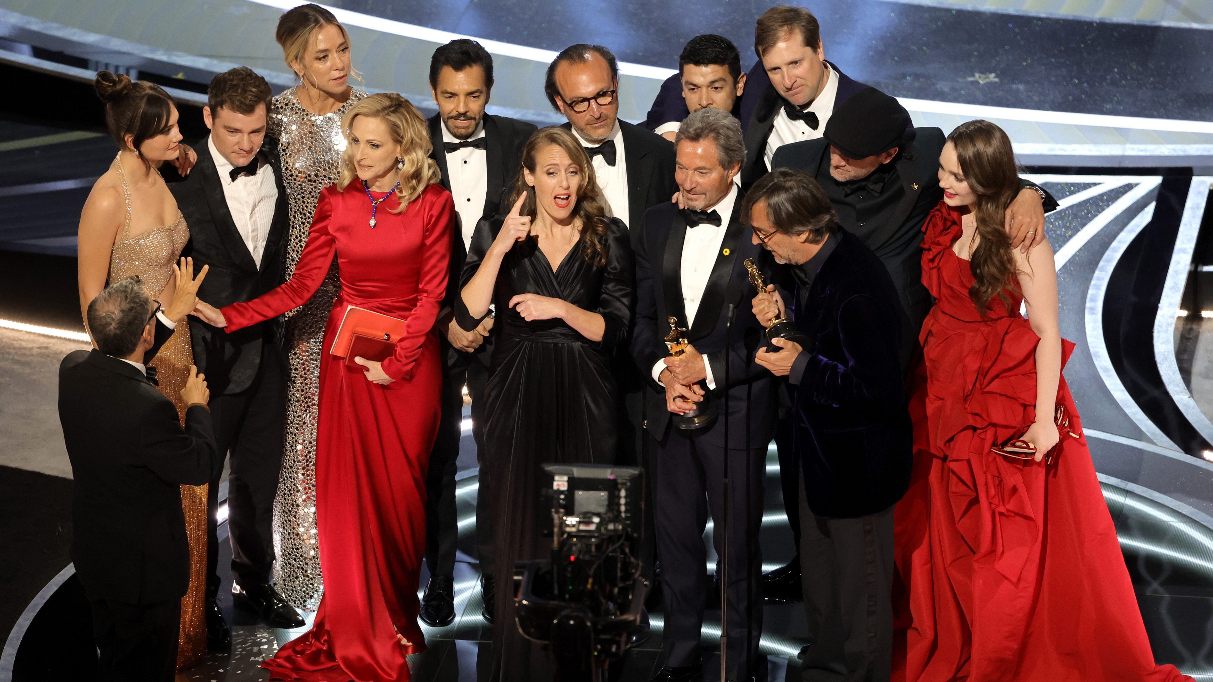 HOLLYWOOD, CALIFORNIA - MARCH 27: (L-R) Emilia Jones, Daniel Durant, Sian Heder, Marlee Matlin, Eugenio Derbez, Fabrice Gianfermi, Patrick Wachsberger, Justin Maurer, Philippe Rousselet, Troy Kotsur, and Amy Forsyth accept the Best Picture award for ‘CODA’ onstage during the 94th Annual Academy Awards at Dolby Theatre on March 27, 2022 in Hollywood, California. (Photo by Neilson Barnard/Getty Images)