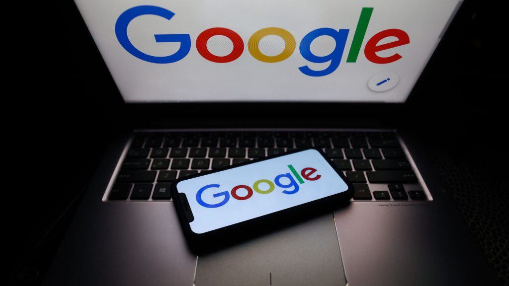 Google logo displayed on phone and laptop screens are seen in this illustration photo taken on October 18, 2020. (Photo Illustration by Jakub Porzycki/NurPhoto via Getty Images)