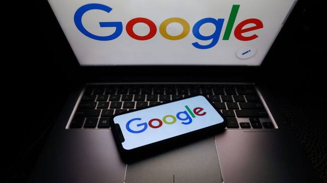 Google logo displayed on phone and laptop screens are seen in this illustration photo taken on October 18, 2020. (Photo Illustration by Jakub Porzycki/NurPhoto via Getty Images)
