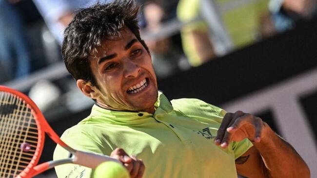 Chile's Christian Garin returns to Germany's Alexander Zverev during their quarter finals match at the ATP Rome Open tennis tournament on May 13, 2022 at Foro Italico in Rome. (Photo by Andreas SOLARO / AFP) (Photo by ANDREAS SOLARO/AFP via Getty Images)
