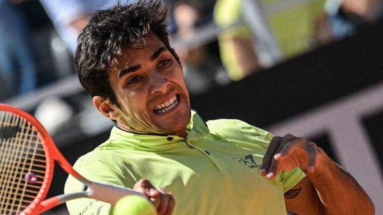 Chile's Christian Garin returns to Germany's Alexander Zverev during their quarter finals match at the ATP Rome Open tennis tournament on May 13, 2022 at Foro Italico in Rome. (Photo by Andreas SOLARO / AFP) (Photo by ANDREAS SOLARO/AFP via Getty Images)