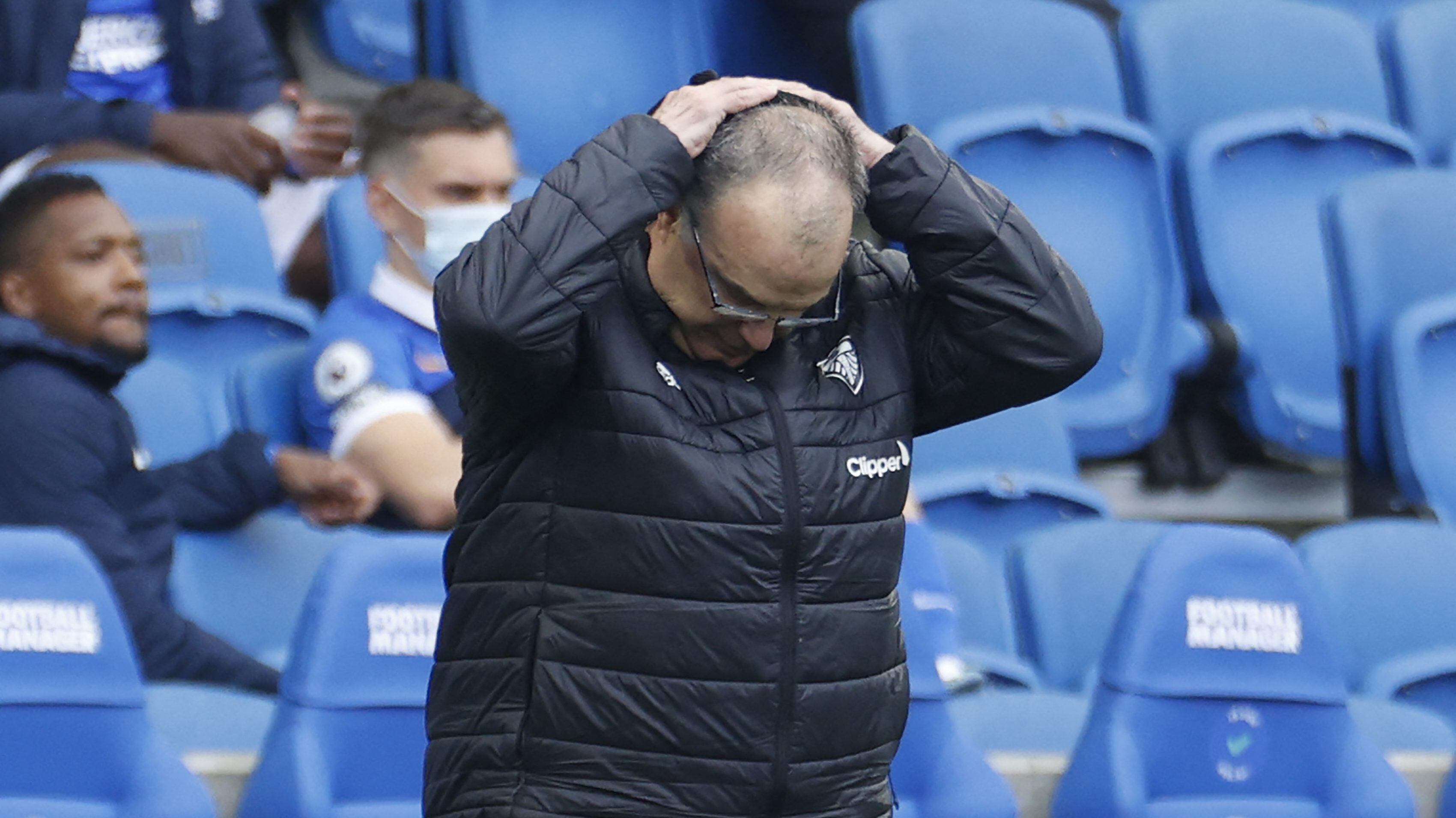 Leeds United's Argentinian head coach Marcelo Bielsa reacts at the final whistle during the English Premier League football match between Brighton and Hove Albion and Leeds United at the American Express Community Stadium in Brighton, southern England on May 1, 2021. - RESTRICTED TO EDITORIAL USE. No use with unauthorized audio, video, data, fixture lists, club/league logos or 'live' services. Online in-match use limited to 120 images. An additional 40 images may be used in extra time. No video emulation. Social media in-match use limited to 120 images. An additional 40 images may be used in extra time. No use in betting publications, games or single club/league/player publications. (Photo by JOHN SIBLEY / POOL / AFP) / RESTRICTED TO EDITORIAL USE. No use with unauthorized audio, video, data, fixture lists, club/league logos or 'live' services. Online in-match use limited to 120 images. An additional 40 images may be used in extra time. No video emulation. Social media in-match use limited to 120 images. An additional 40 images may be used in extra time. No use in betting publications, games or single club/league/player publications. / RESTRICTED TO EDITORIAL USE. No use with unauthorized audio, video, data, fixture lists, club/league logos or 'live' services. Online in-match use limited to 120 images. An additional 40 images may be used in extra time. No video emulation. Social media in-match use limited to 120 images. An additional 40 images may be used in extra time. No use in betting publications, games or single club/league/player publications. (Photo by JOHN SIBLEY/POOL/AFP via Getty Images)