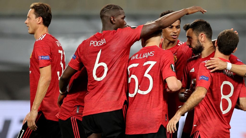 COLOGNE, GERMANY - AUGUST 10: Bruno Fernandes of Manchester United celebrates with teammates after scoring his sides first goal during the UEFA Europa League Quarter Final between Manchester United and FC Kobenhavn at RheinEnergieStadion on August 10, 2020 in Cologne, Germany. (Photo by Wolfgang Rattay/Pool via Getty Images)