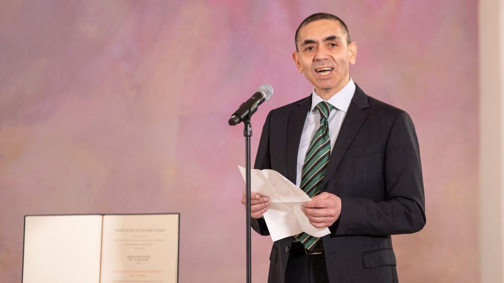BERLIN, GERMANY - MARCH 19: Ugur Sahin, Co-founder of Biontech SE, makes a speech after receiving the Federal Order Of Merit from President Frank-Walter Steinmeier at Schloss Bellevue on March 19, 2021 in Berlin, Germany. (Photo by Andreas Gora - Pool/Getty Images)