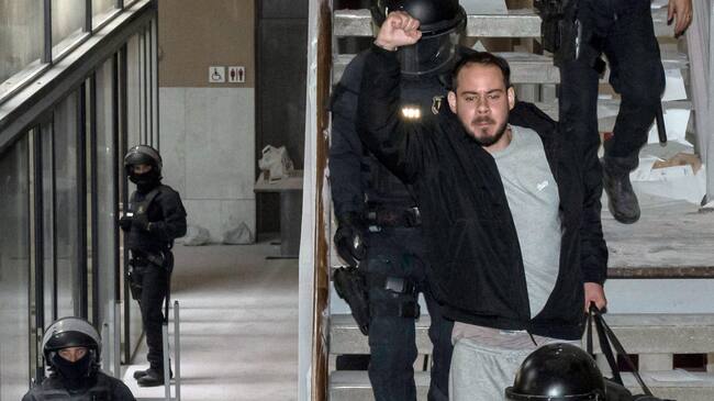 Catalan rapper Pablo Hasel is arrested by police at the University of Lleida, 150 kms (90 miles) west of Barcelona, on February 16, 2021 where he had barricaded himself. - Spanish police today arrested a rapper who barricaded himself inside a university after he was controversially sentenced to nine months in jail over a string of tweets, television images showed. Pablo Hasel had been given until the night of February 12 to turn himself in to begin serving his sentence after being convicted for glorifying terrorism, slander and libel against the crown and state institutions. (Photo by J. Martin / AFP) (Photo by J. MARTIN/AFP via Getty Images)