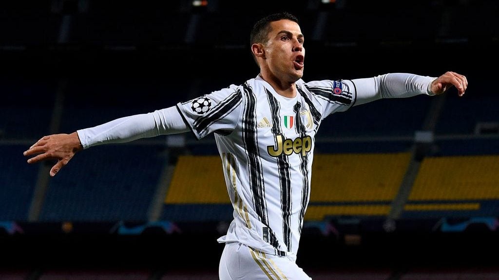 Juventus' Portuguese forward Cristiano Ronaldo celebrates after scoring his team's third goal during the UEFA Champions League group G football match between Barcelona and Juventus at the Camp Nou stadium in Barcelona on December 8, 2020. (Photo by Josep LAGO / AFP) (Photo by JOSEP LAGO/AFP via Getty Images)