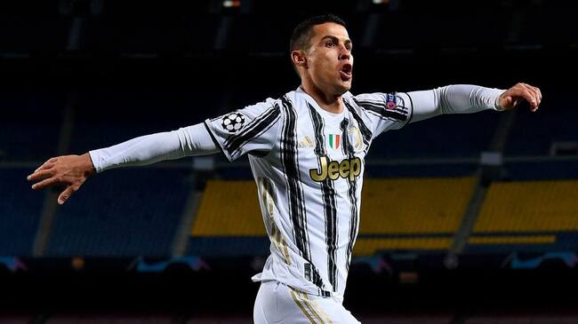 Juventus' Portuguese forward Cristiano Ronaldo celebrates after scoring his team's third goal during the UEFA Champions League group G football match between Barcelona and Juventus at the Camp Nou stadium in Barcelona on December 8, 2020. (Photo by Josep LAGO / AFP) (Photo by JOSEP LAGO/AFP via Getty Images)