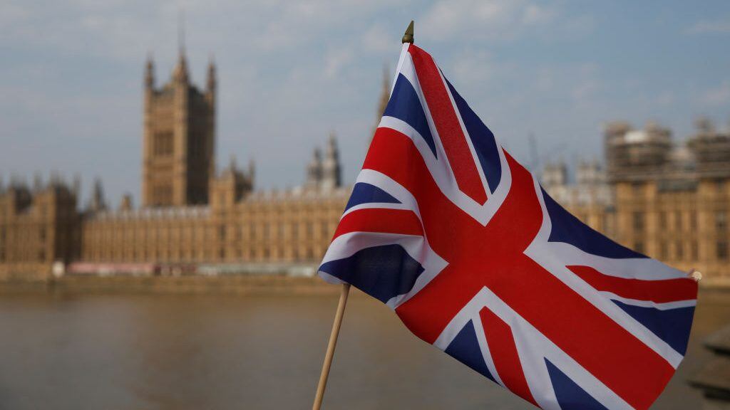 LONDON, ENGLAND - AUGUST 09: A Union Jack flag outside the Houses of Parliament on August 9, 2020 in London, United Kingdom. Southern England saw several days of high temperatures, with the mercury hitting 36.4C at Heathrow and Kew Gardens, England's hottest August day in 17 years. (Photo by Hollie Adams/Getty Images)