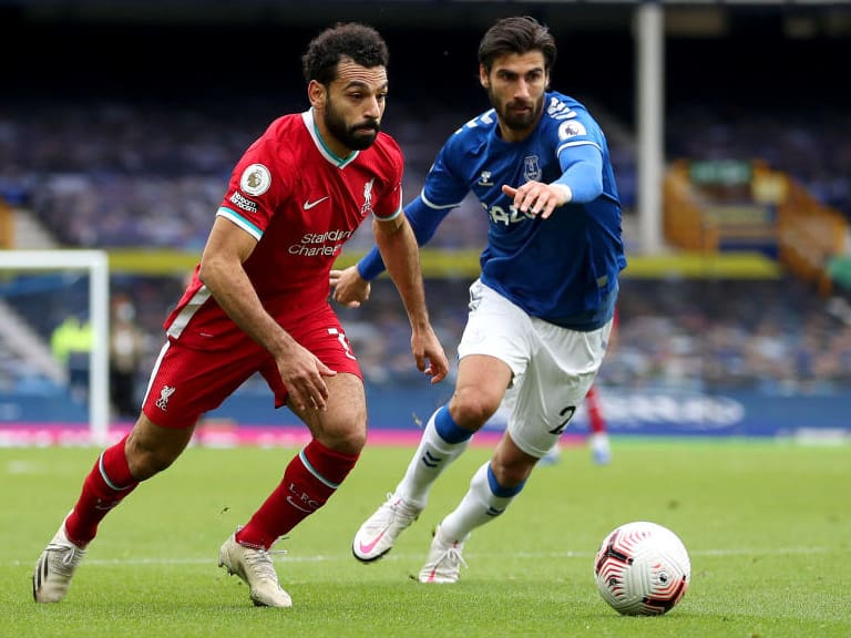 LIVERPOOL, ENGLAND - OCTOBER 17: Mohamed Salah of Liverpool runs with the ball during the Premier League match between Everton and Liverpool at Goodison Park on October 17, 2020 in Liverpool, England. Sporting stadiums around the UK remain under strict restrictions due to the Coronavirus Pandemic as Government social distancing laws prohibit fans inside venues resulting in games being played behind closed doors. (Photo by Catherine Ivill/Getty Images)