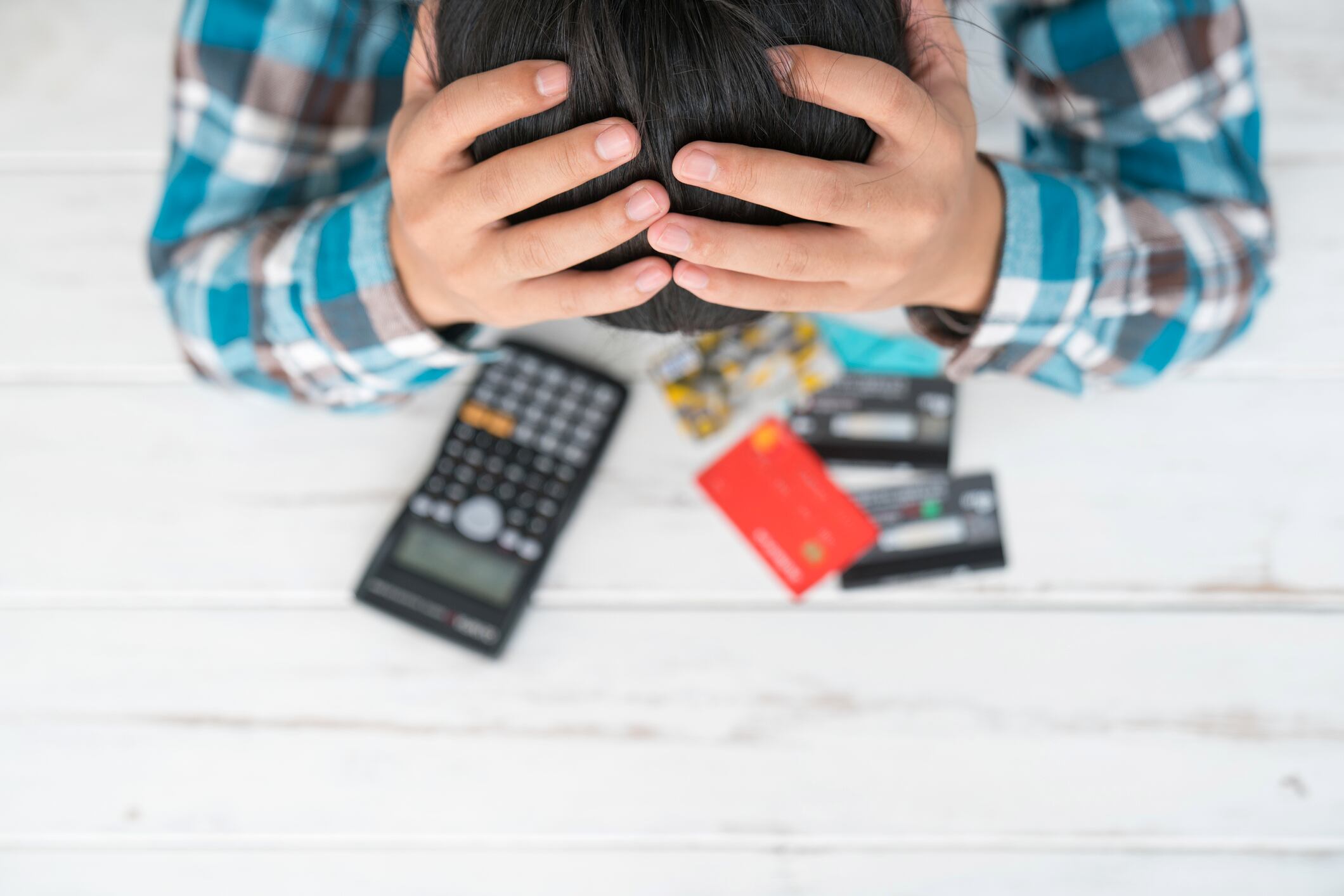 Concept of The man is stressed with debt owed by using credit card