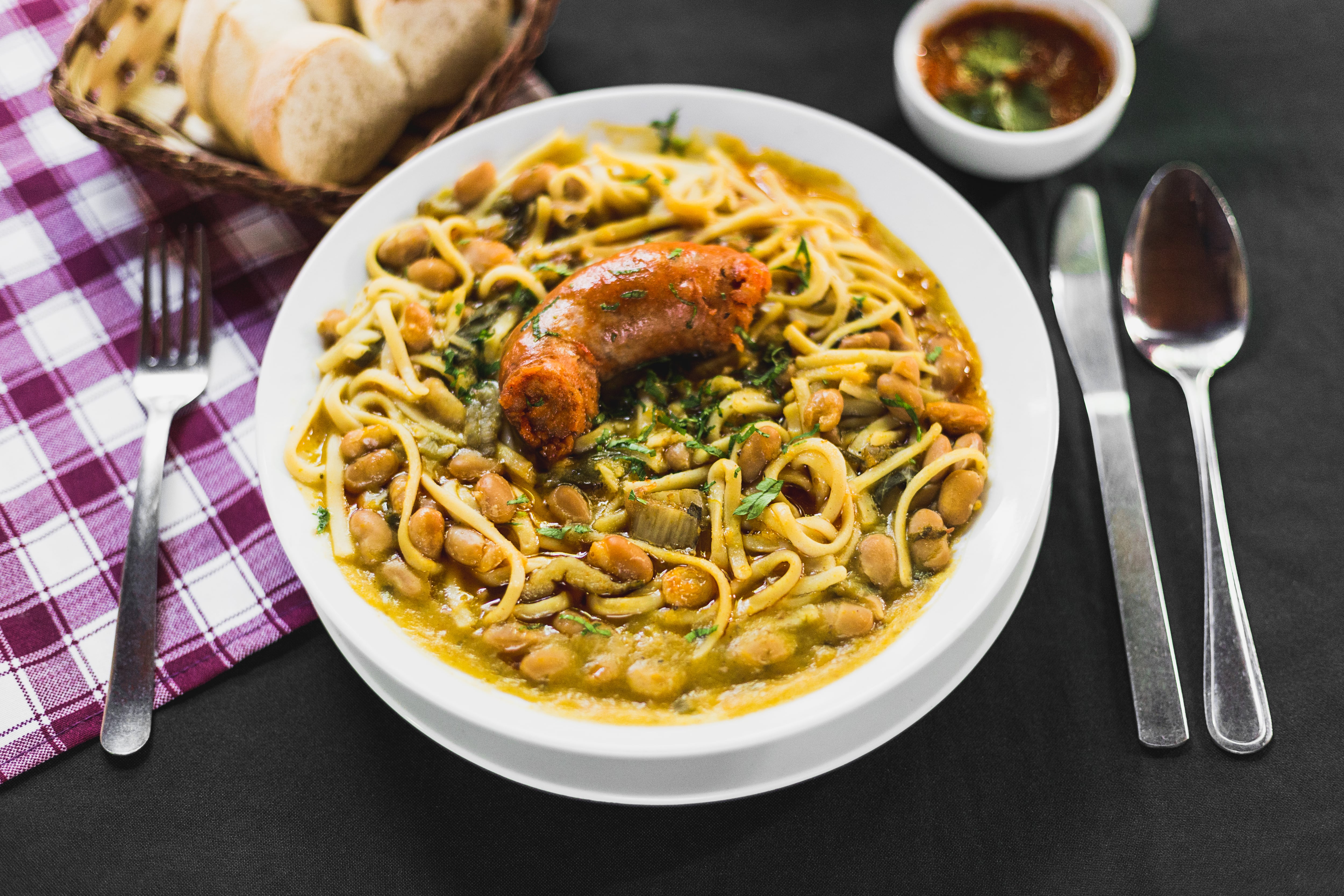 Chilean beans with rustic sausage on a typical chilean table