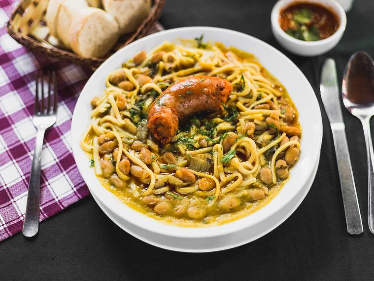 Chilean beans with rustic sausage on a typical chilean table
