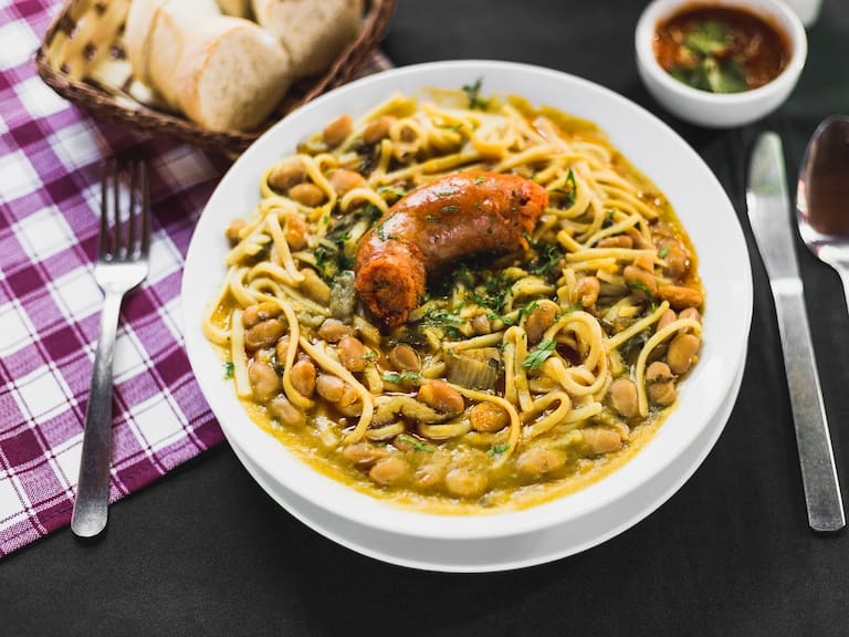 Chilean beans with rustic sausage on a typical chilean table