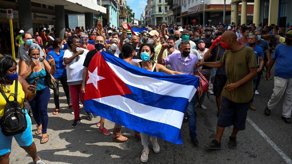 TOPSHOT - People take part in a demonstration to support the government of the Cuban President Miguel Diaz-Canel in Havana, on July 11, 2021. - Thousands of Cubans took part in rare protests Sunday against the communist government, marching through a town chanting "Down with the dictatorship" and "We want liberty." (Photo by YAMIL LAGE / AFP) (Photo by YAMIL LAGE/AFP via Getty Images)