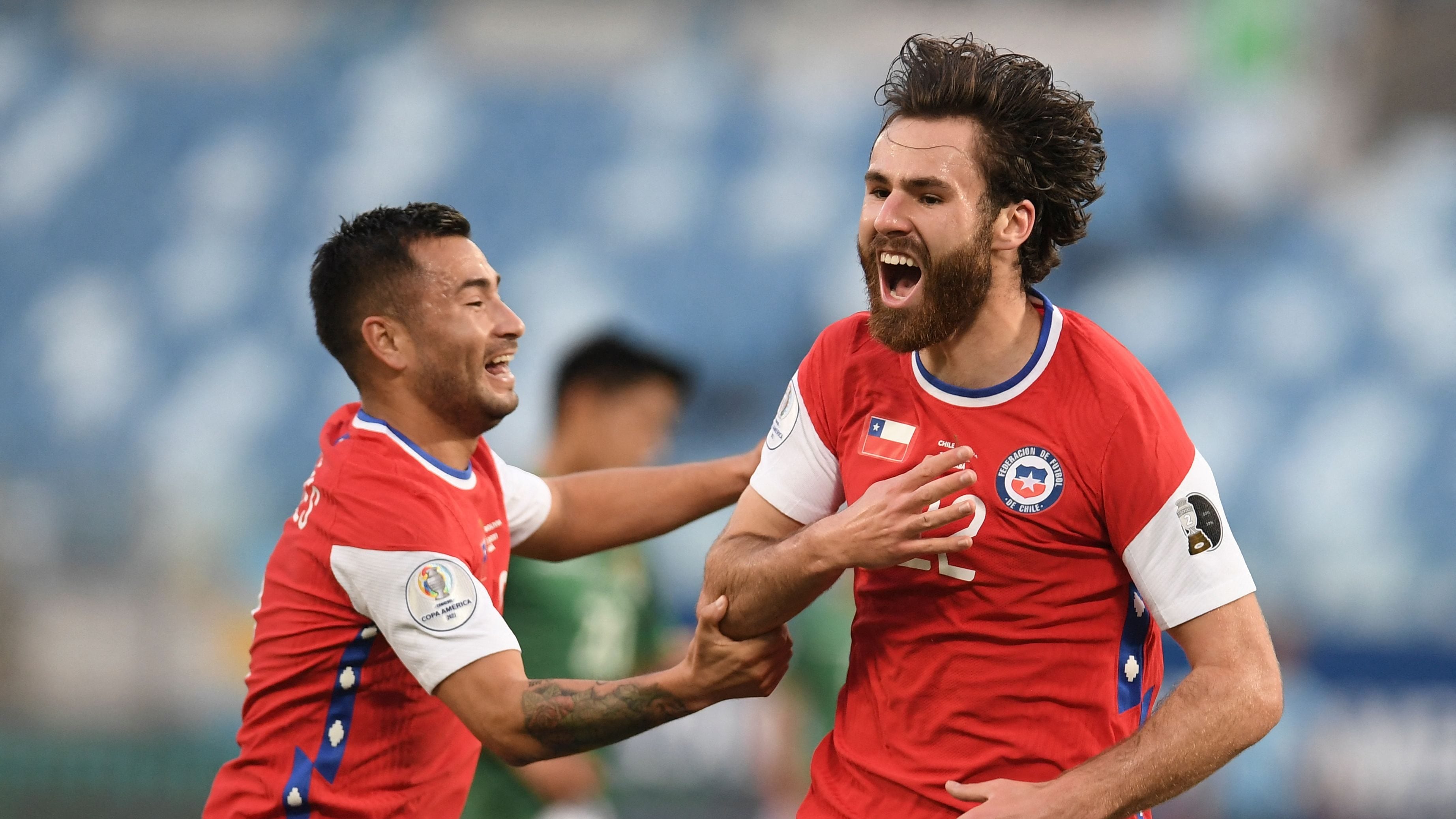 Chile's Ben Brereton (R) celebrates after scoring against Bolivia during their Conmebol Copa America 2021 football tournament group phase match at the Pantanal Arena in Cuiaba, Brazil, on June 18, 2021. (Photo by Douglas MAGNO / AFP) (Photo by DOUGLAS MAGNO/AFP via Getty Images)