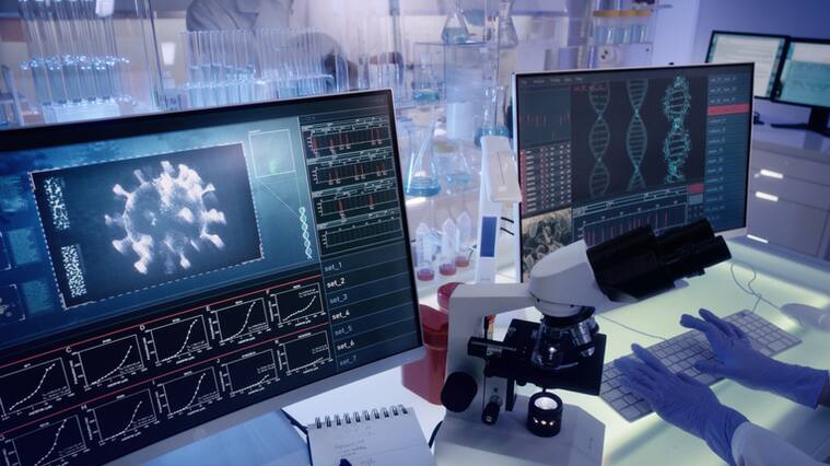 Modern laboratory interior. Coronavirus research. Pathogen model on the screens