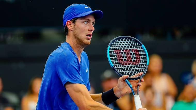 Nicolas Jarry of Chile eyes a return against Dusan Lajovic of Serbia during their men's singles match on day six of the ATP Cup tennis tournament in Brisbane on January 8, 2020. (Photo by Patrick HAMILTON / AFP) / -- IMAGE RESTRICTED TO EDITORIAL USE - STRICTLY NO COMMERCIAL USE -- (Photo by PATRICK HAMILTON/AFP /AFP via Getty Images)
