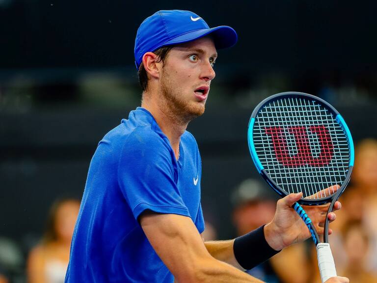 Nicolas Jarry of Chile eyes a return against Dusan Lajovic of Serbia during their men's singles match on day six of the ATP Cup tennis tournament in Brisbane on January 8, 2020. (Photo by Patrick HAMILTON / AFP) / -- IMAGE RESTRICTED TO EDITORIAL USE - STRICTLY NO COMMERCIAL USE -- (Photo by PATRICK HAMILTON/AFP /AFP via Getty Images)