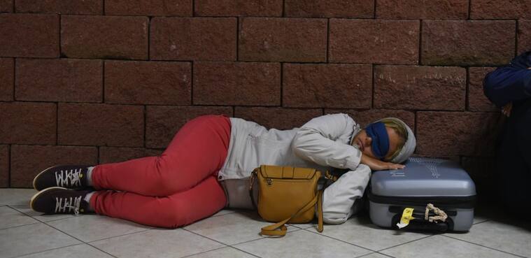 HANGA ROA, CHILE - 2019/09/23: A woman is seen sleeping at the airportHanga Roa is the capital of Easter Island, a Chilean island in the southeastern Pacific Ocean. The village has around 5,000 inhabitants, which comprises between 87 and 90 percent of the total population of the island. Excluding a small percentage still engaged in traditional fishing and small-scale farming, the majority of the population is engaged in tourism which is the main source of income. (Photo by John Milner/SOPA Images/LightRocket via Getty Images)