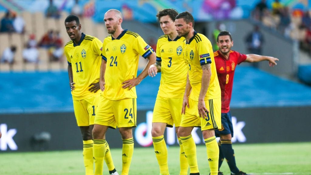 14 June 2021, Spain, Sevilla: Football: European Championship Group E, Spain - Sweden: Sweden's Alexander Isak (l-r) stands next to Marcus Danielson, Victor Lindelöf and Sweden's Marcus Berg while Spain's Koke stands behind. Important: For editorial news reporting purposes only. Not used for commercial or marketing purposes without prior written approval of UEFA. Images must appear as still images and must not emulate match action video footage. Photographs published in online publications (whether via the Internet or otherwise) shall have an interval of at least 20 seconds between the posting. Football: European Championship, Spain - Sweden, Preliminary round, Group E, Matchday 1 Photo: Cezaro De Luca/dpa (Photo by Cezaro De Luca/picture alliance via Getty Images)