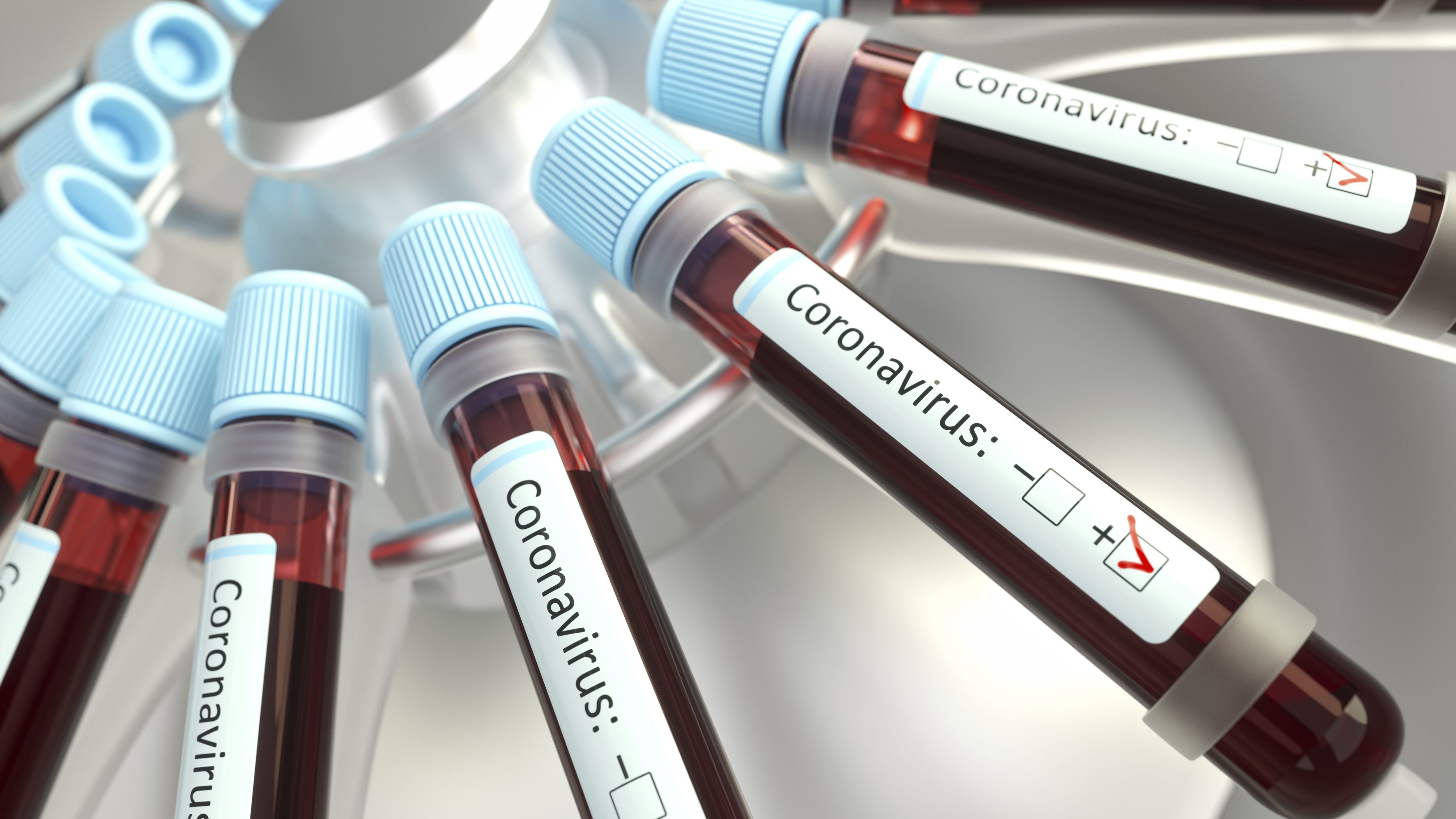Coronaviruses research, conceptual illustration. Vials of blood in a centrifuge being tested for coronavirus infection.