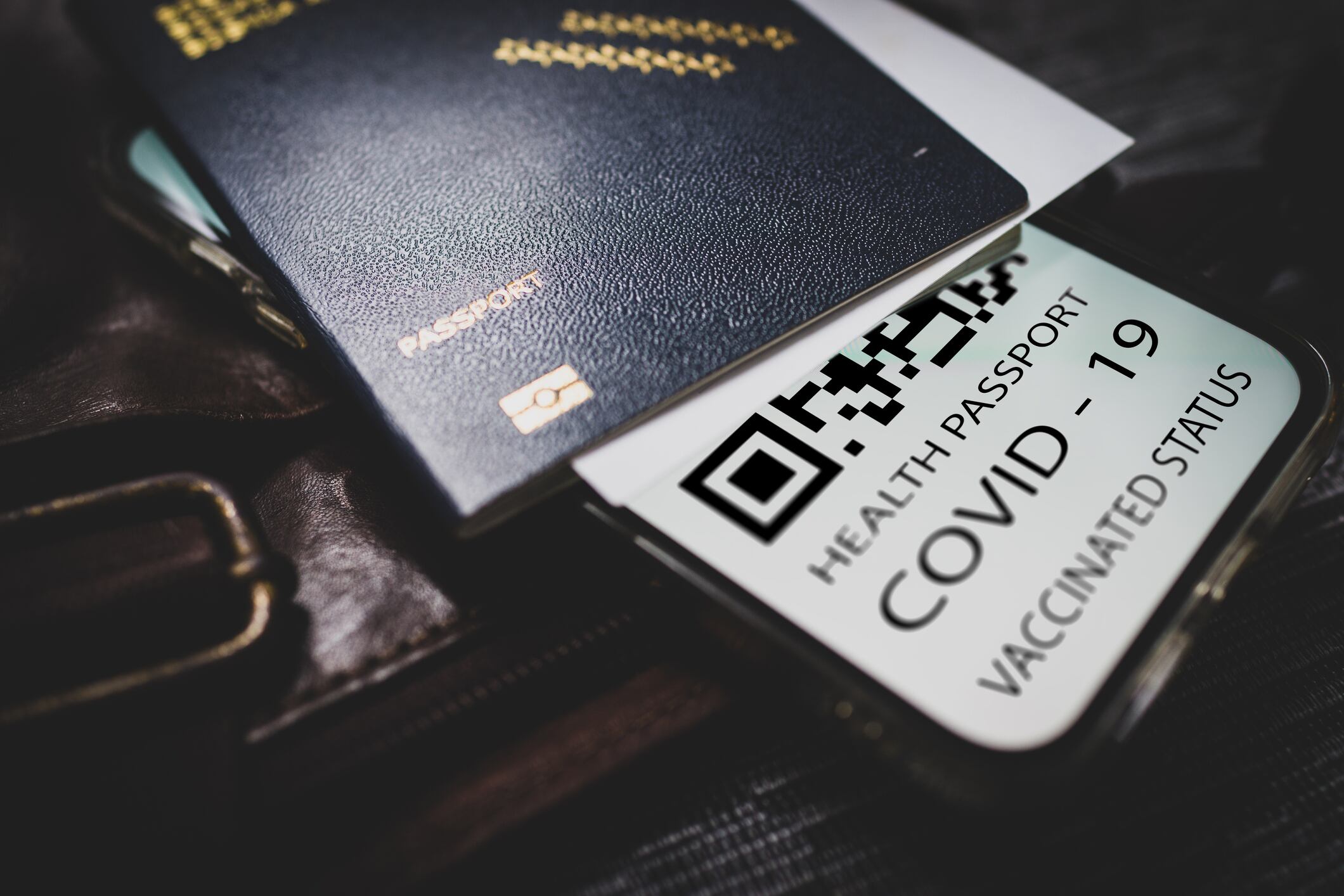 Covid-19 passport with QR code on smartphone, Getty Images.