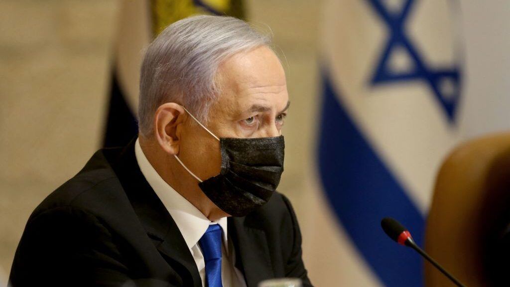 Israeli Prime Minister Benjamin Netanyahu, wearing a mask for protection against the COVID-19 pandemic, attends a special cabinet meeting on the occasion of "Jerusalem Day" at the city's municipality building on May 9, 2021. - Clashes have repeatedly broken out over the past week in east Jerusalem's Sheikh Jarrah neighbourhood, fuelled by a years-long attempt by Jewish settlers to take over Palestinian homes. Israel's Supreme Court is to hold a new hearing in the case on Monday, when Israelis mark Jerusalem Day to celebrate the "liberation" of the city. (Photo by Amit SHABI / POOL / AFP) (Photo by AMIT SHABI/POOL/AFP via Getty Images)