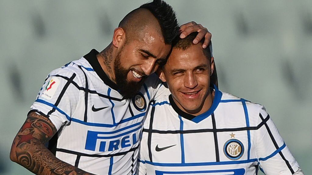 Inter Milan's Chilean midfielder Arturo Vidal (L) celebrates with Inter Milan's Chilean forward Alexis Sanchez after opening the scoring during the Italian Cup (Coppa Italia) round of sixteen football match Fiorentina vs Inter Milan on January 13, 2021 at the Artemio-Franchi stadium in Florence. (Photo by Vincenzo PINTO / AFP) (Photo by VINCENZO PINTO/AFP via Getty Images)