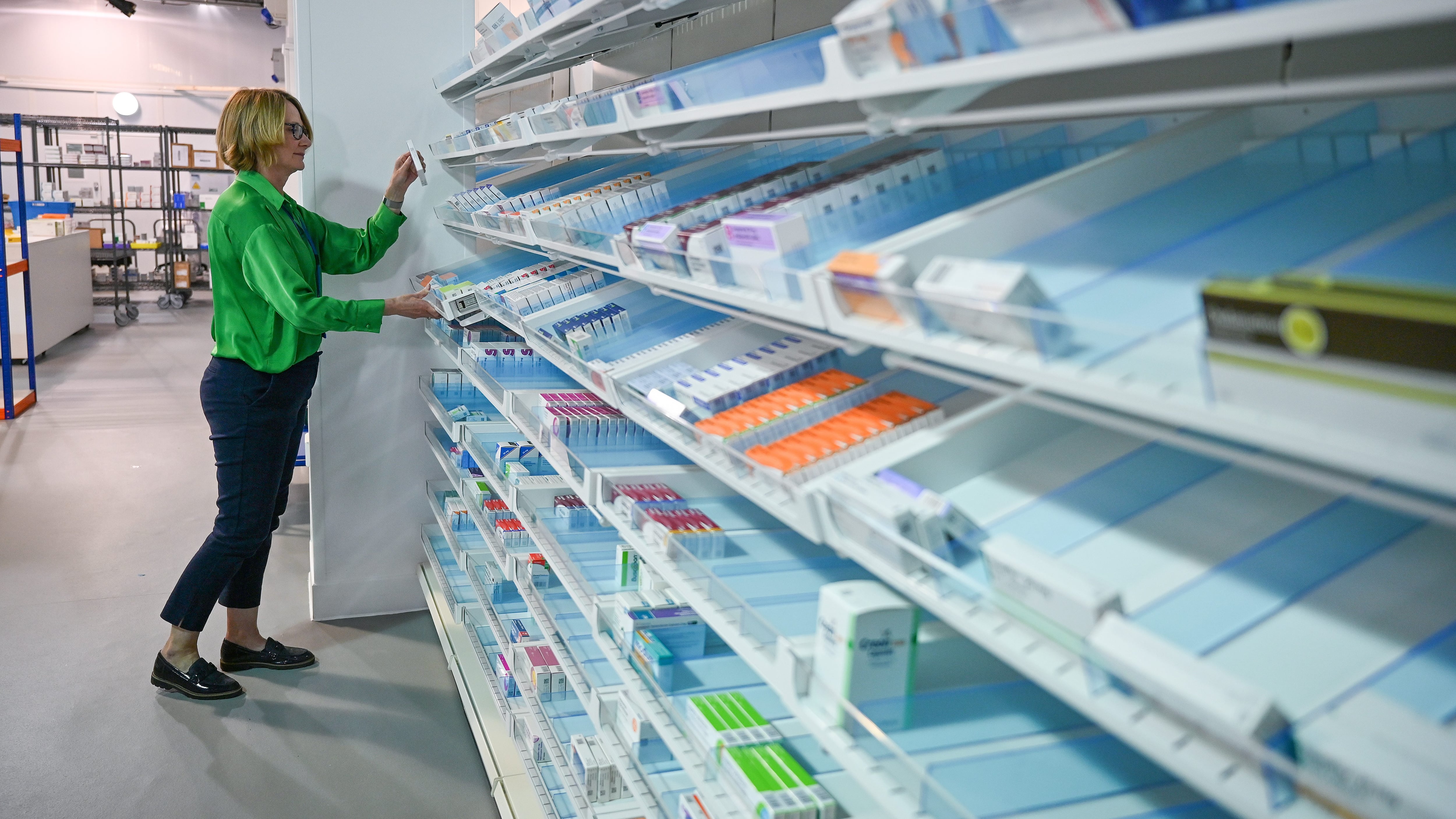 GLASGOW, SCOTLAND - APRIL 20: A member of NHS staff handles medication inside the on-site pharmacy at the new NHS Louisa Jordan hospital which is now ready to take its first coronavirus patients on April 20, 2020 in Glasgow, United Kingdom. The British government has extended the lockdown restrictions first introduced on March 23 that are meant to slow the spread of COVID-19. (Photo by Jeff J Mitchell/Getty Images)