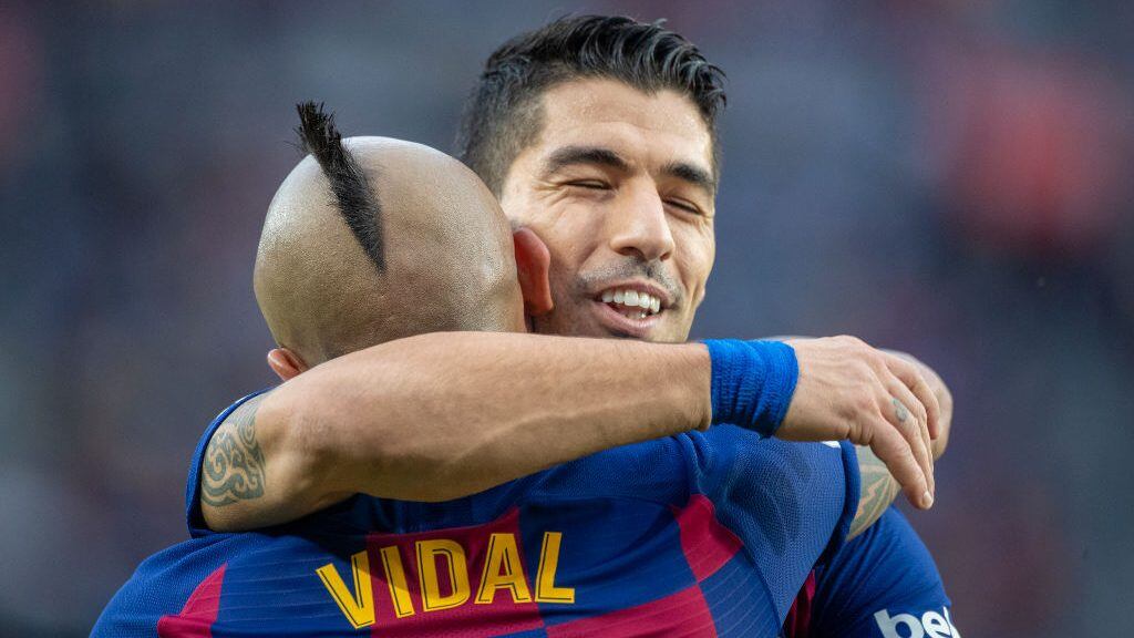 BARCELONA, SPAIN - December 21:   Arturo Vidal #22 of Barcelona celebrates with Luis Suarez #9 of Barcelona after scoring his sides second goal during the Barcelona V Alaves, La Liga regular season match at Estadio Camp Nou on December 21st  2019 in Barcelona, Spain. (Photo by Tim Clayton/Corbis via Getty Images)
