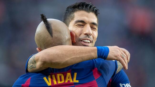 BARCELONA, SPAIN - December 21: Arturo Vidal #22 of Barcelona celebrates with Luis Suarez #9 of Barcelona after scoring his sides second goal during the Barcelona V Alaves, La Liga regular season match at Estadio Camp Nou on December 21st 2019 in Barcelona, Spain. (Photo by Tim Clayton/Corbis via Getty Images)