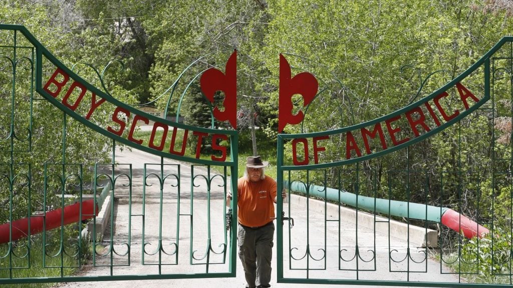 PAYSON, UT - MAY 9: Mark Veteto, Camp Ranger for the Maple Dell Scout Camp, owned by the Utah National Park Council of the Boy Scouts of America, closes the front gate for the day on May 9, 2018 outside Payson, Utah. The Utah-based Mormon Church announced that at the end of 2019 they will end their 105-year relationship with the Boy Scouts of America and drop the Boy Scout Program and replace it with their own "gospel oriented" program. This will have a severe impact on the scouting program, especially in Utah where 97 percent of the troops are sponsored by the Mormon Church. (Photo by George Frey/Getty Images)