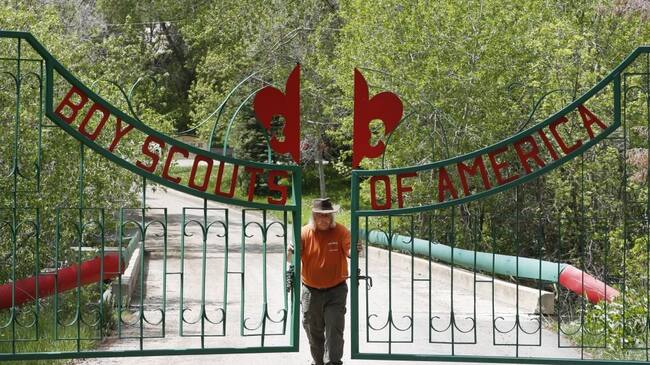 PAYSON, UT - MAY 9: Mark Veteto, Camp Ranger for the Maple Dell Scout Camp, owned by the Utah National Park Council of the Boy Scouts of America, closes the front gate for the day on May 9, 2018 outside Payson, Utah. The Utah-based Mormon Church announced that at the end of 2019 they will end their 105-year relationship with the Boy Scouts of America and drop the Boy Scout Program and replace it with their own "gospel oriented" program. This will have a severe impact on the scouting program, especially in Utah where 97 percent of the troops are sponsored by the Mormon Church. (Photo by George Frey/Getty Images)