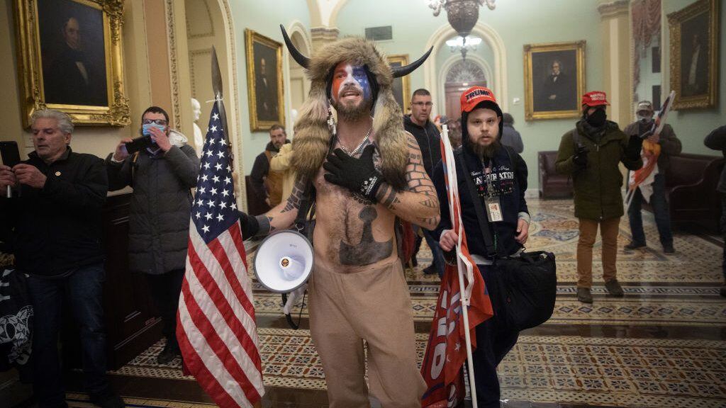 WASHINGTON, DC - JANUARY 06:  A pro-Trump mob confronts U.S. Capitol police outside the Senate chamber of the U.S. Capitol Building on January 06, 2021 in Washington, DC. Congress held a joint session today to ratify President-elect Joe Biden's 306-232 Electoral College win over President Donald Trump. A group of Republican senators said they would reject the Electoral College votes of several states unless Congress appointed a commission to audit the election results. (Photo by Win McNamee/Getty Images)