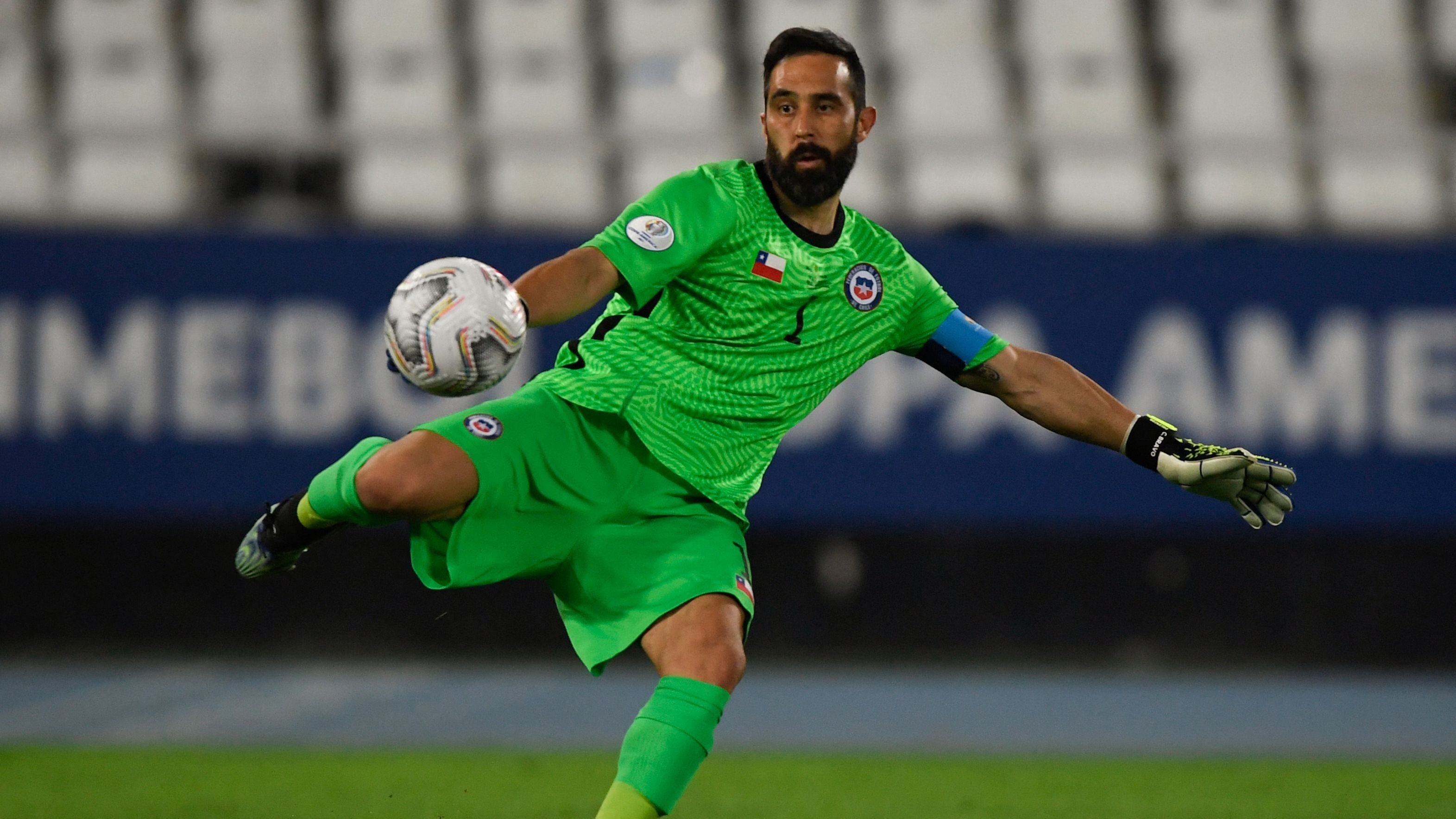 Chile's goalkeeper Claudio Bravo clears a ball during their Conmebol 2021 Copa America football tournament quarter-final match against Brazil at the Nilton Santos Stadium in Rio de Janeiro, Brazil, on July 2, 2021. (Photo by MAURO PIMENTEL / AFP) (Photo by MAURO PIMENTEL/AFP via Getty Images)