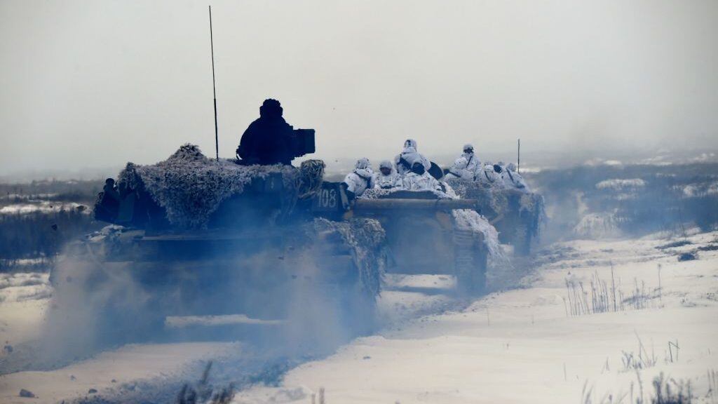 TOPSHOT - Ukrainian servicemen on armored personal carriers (APC) take part in brigade tactical exercises with combat shooting near Goncharivske willage, Chernihiv region, not far from the border with Russia on December 3, 2018. - Tensions between Ukraine and Russia rose on November 25, when Russian forces seized three Ukranian navy vessels and their crew. Ukraine imposed martial law for 30 days in 10 regions that border Russia, the Black Sea and the Azov Sea on November 28. (Photo by Sergei SUPINSKY / AFP) (Photo credit should read SERGEI SUPINSKY/AFP via Getty Images)