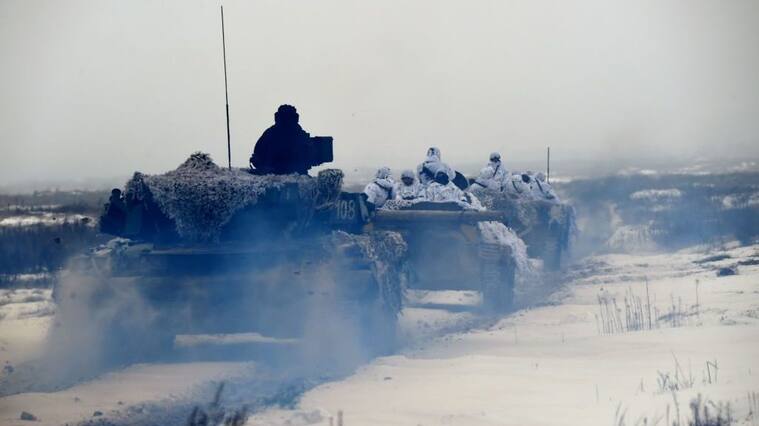 TOPSHOT - Ukrainian servicemen on armored personal carriers (APC) take part in brigade tactical exercises with combat shooting near Goncharivske willage, Chernihiv region, not far from the border with Russia on December 3, 2018. - Tensions between Ukraine and Russia rose on November 25, when Russian forces seized three Ukranian navy vessels and their crew. Ukraine imposed martial law for 30 days in 10 regions that border Russia, the Black Sea and the Azov Sea on November 28. (Photo by Sergei SUPINSKY / AFP) (Photo credit should read SERGEI SUPINSKY/AFP via Getty Images)