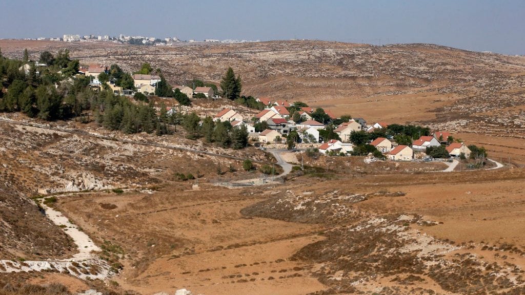 A picture taken on October 14, 2020, shows the Israeli Shimaa settlement south of the city of Hebron in the occupied West Bank, with the Palestinian village of Samua in the background. (Photo by HAZEM BADER / AFP) (Photo by HAZEM BADER/AFP via Getty Images)
