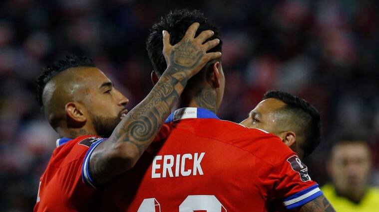 Chile's Erick Pulgar (C) celebrates with teammates after scoring against Venezuela during the South American qualification football match for the FIFA World Cup Qatar 2022, at the San Carlos de Apoquindo stadium in Santiago, on October 14, 2021. (Photo by CLAUDIO REYES / POOL / AFP) (Photo by CLAUDIO REYES/POOL/AFP via Getty Images)
