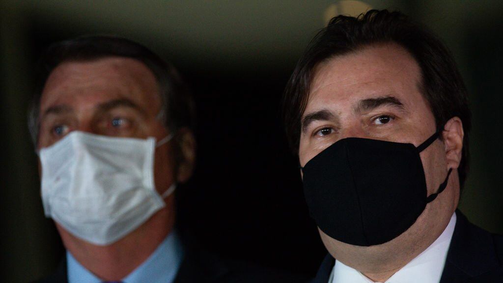 BRASILIA, BRAZIL - AUGUST 12: Rodrigo Maia, president of Brazil's Lower House,  and Jair Bolsonaro President of Brazil makes a pronouncement reaffirming his commitment to the government spending ceiling amidst the coronavirus (COVID-19) pandemic at the Alvorada Palace on August 12, 2020 in Brasilia. President of the Senate Davi Alcolumbre, Economy Minister Paulo Guedes and parliamentarians and ministers accompanied. Brazil has over 3.164,000 confirmed positive cases of Coronavirus and has over 104,201 deaths. (Photo by Andressa Anholete/Getty Images)