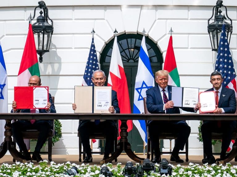 WASHINGTON, USA - SEPTEMBER 15: (----EDITORIAL USE ONLY â MANDATORY CREDIT - &quot;THE WHITE HOUSE / TIA DUFOUR / HANDOUT&quot; - NO MARKETING NO ADVERTISING CAMPAIGNS - DISTRIBUTED AS A SERVICE TO CLIENTS----) U.S. President Donald Trump (2nd R), Israeli Prime Minister Benjamin Netanyahu (2nd L), UAE Foreign Minister Abdullah bin Zayed Al Nahyan (R) and Bahrain Foreign Minister Abdullatif bin Rashid Al Zayani (L) attend a signing ceremony for the agreements on &quot;normalization of relations&quot; reached between Israel, the United Arab Emirates (UAE) and Bahrain at the White House in Washington, United States on September 15, 2020. (Photo by The White House / Tia Dufour / Handout/Anadolu Agency via Getty Images)