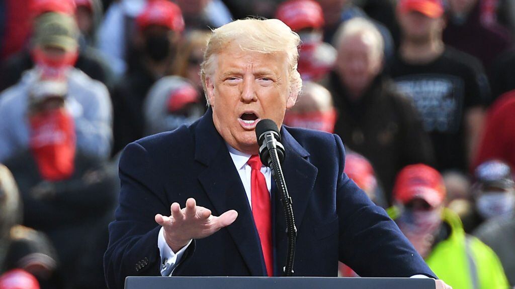 US President Donald Trump speaks during a campaign rally at Manchester-Boston Regional Airport in Londonderry, New Hampshire on October 25, 2020. - Donald Trump's reelection campaign on Sunday sought to brush off another Covid outbreak in his team by focusing its attacks on Joe Biden's energy levels and accusing him of "47 years of failure" in Washington. Nine days before the vote, the US has been engulfed by a surge in Covid-19 cases, reaching a record number of daily infections for a second day running on Saturday with nearly 89,000 new cases. (Photo by MANDEL NGAN / AFP) (Photo by MANDEL NGAN/AFP via Getty Images)
